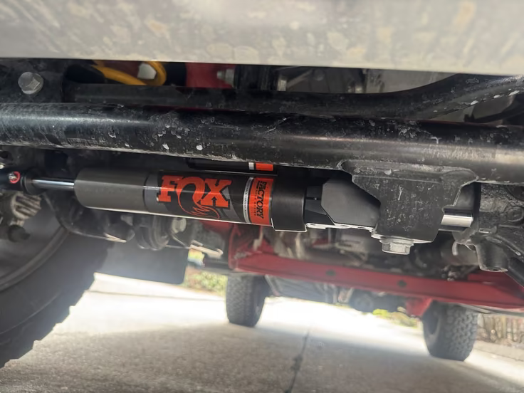 The installed FOX stabilizer at AVIF quality 60, retaining the red lettering and fine scratches on the black metal above it.